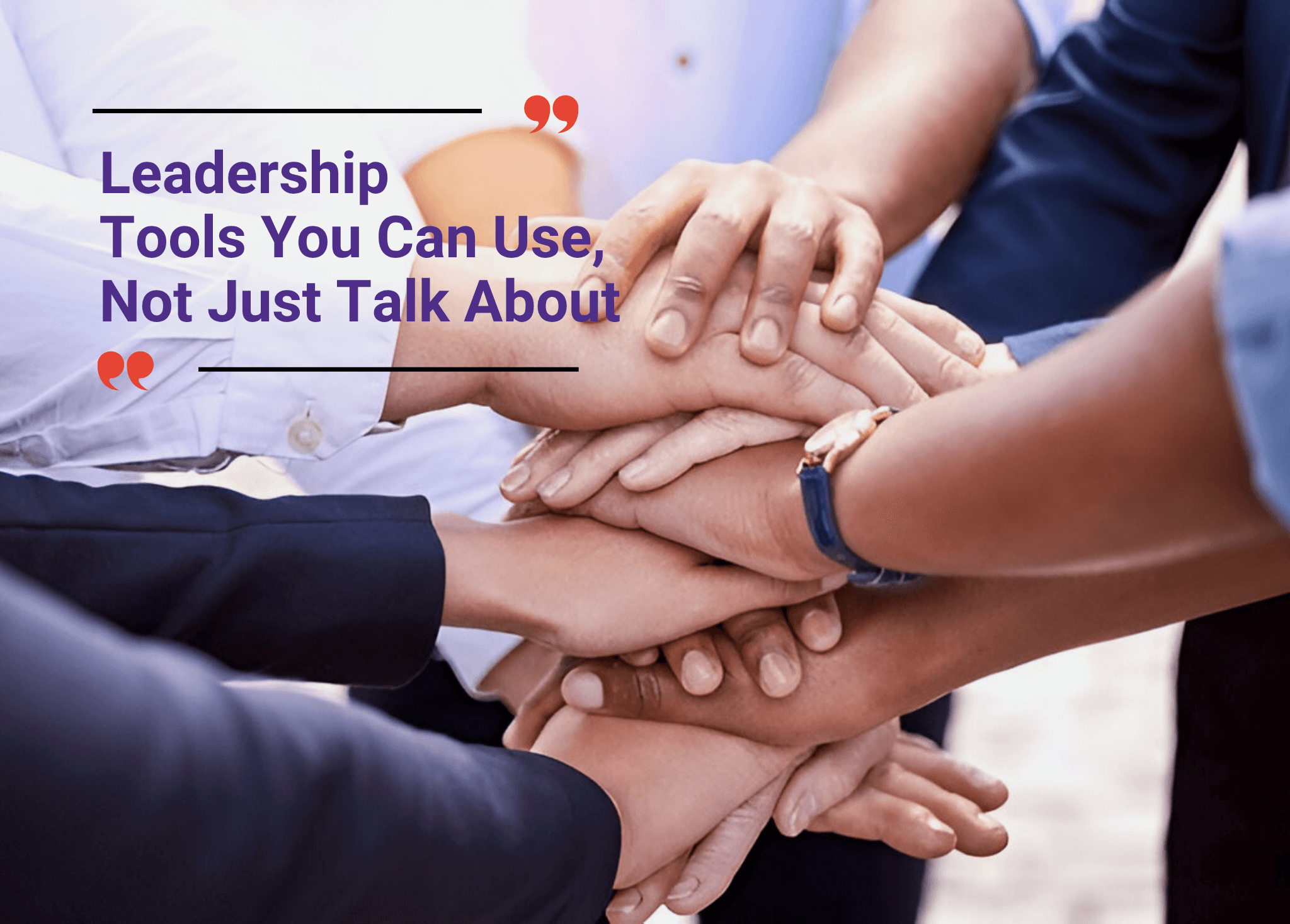 Team members stacking hands as a symbol of leadership and unity.