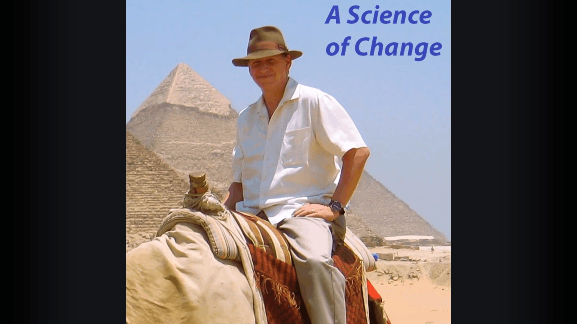 Man riding camel near pyramids, "A Science of Change".