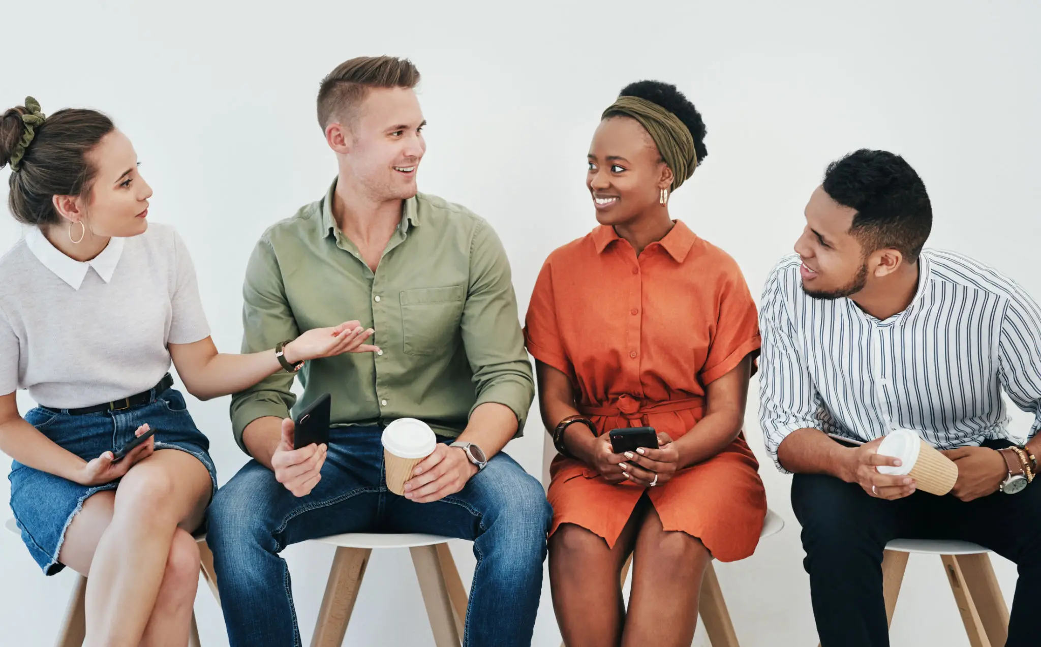 Group of people sitting and talking together.