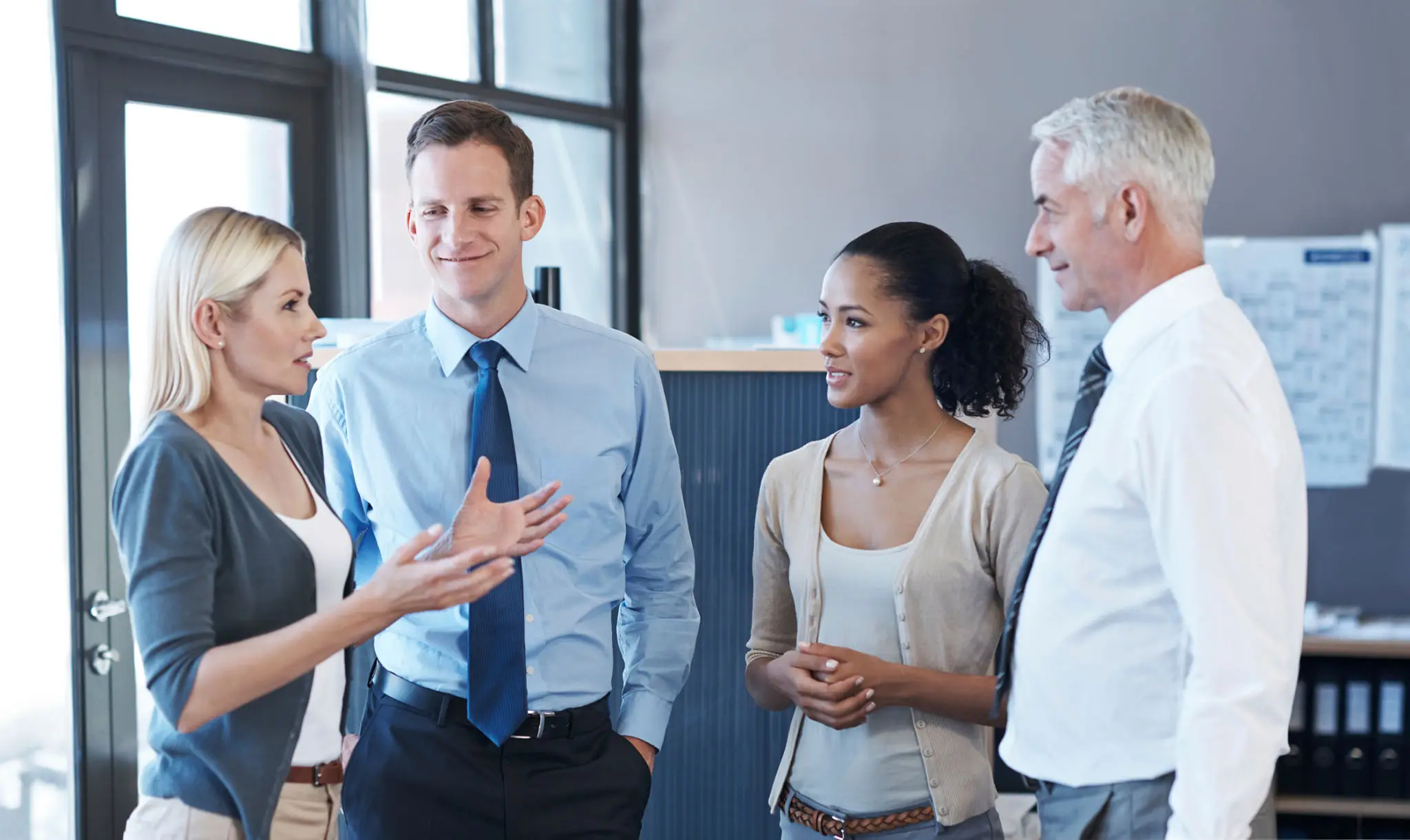 Group discussing in a professional office setting.